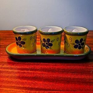 Partylite ceramic 4 piece candle holder set with candles.
